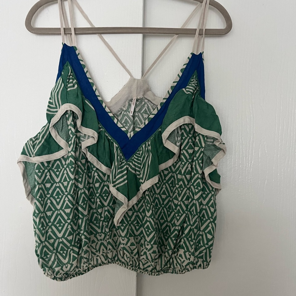 Free People ruffle tank top.  Never worn with tags.  Size medium